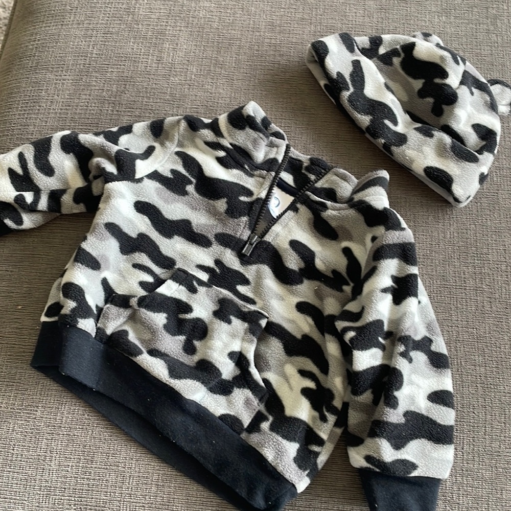Matching fleece sweatshirt and beanie set.